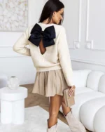 Πλεκτή μπλούζα με άνοιγμα και φιόγκο στην πλάτη